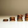 piles of coins increasing in size