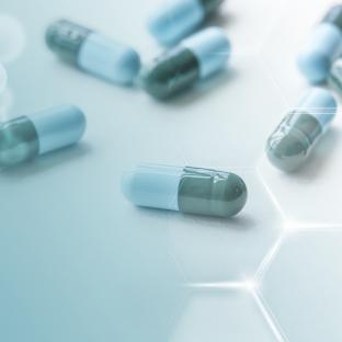 An image showing blue and green pills