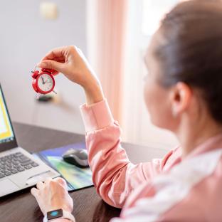 Woman looking at a clock