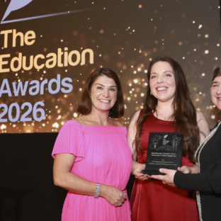 ASI's Alison McCarthy (middle) and Cathryn O'Leary (right) accepting the award at The Education Awards 2026
