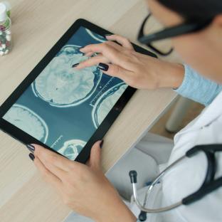 brain scan image on tablet
