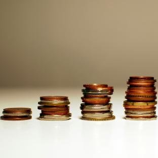 piles of coins increasing in size