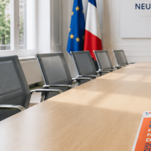 Image of meeting room with ND strategy on table