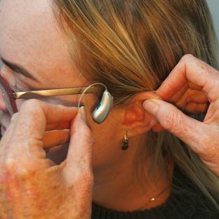 Woman being fitted for a hearing aid